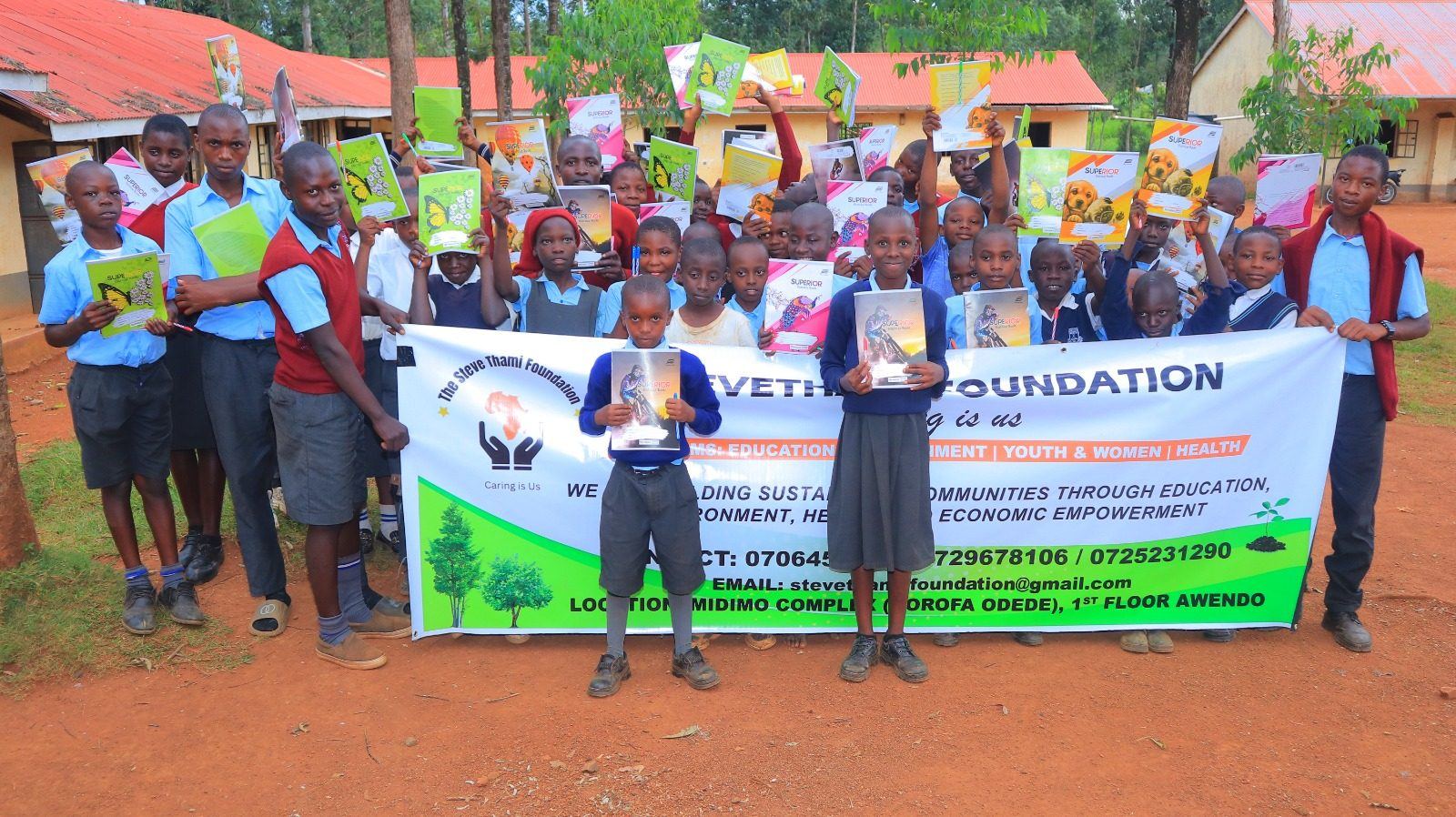 Foundation staff and youth group photo with banner