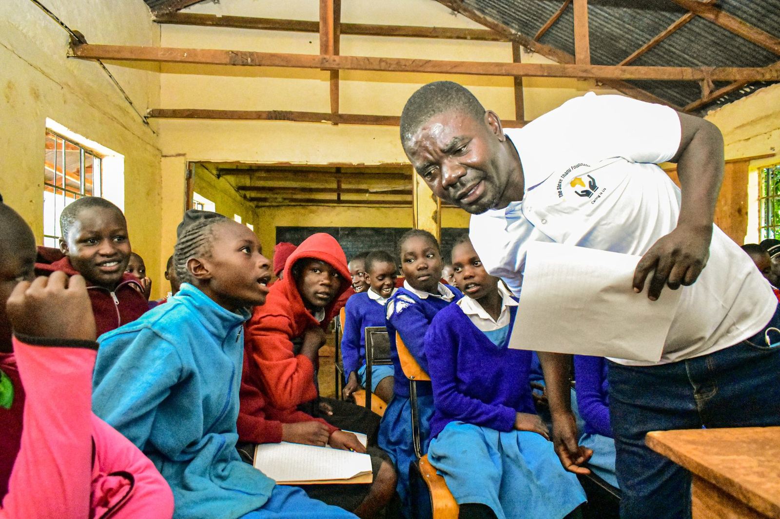 Steve Thami Foundation leader teaching students in a Migori County, Kenya classroom