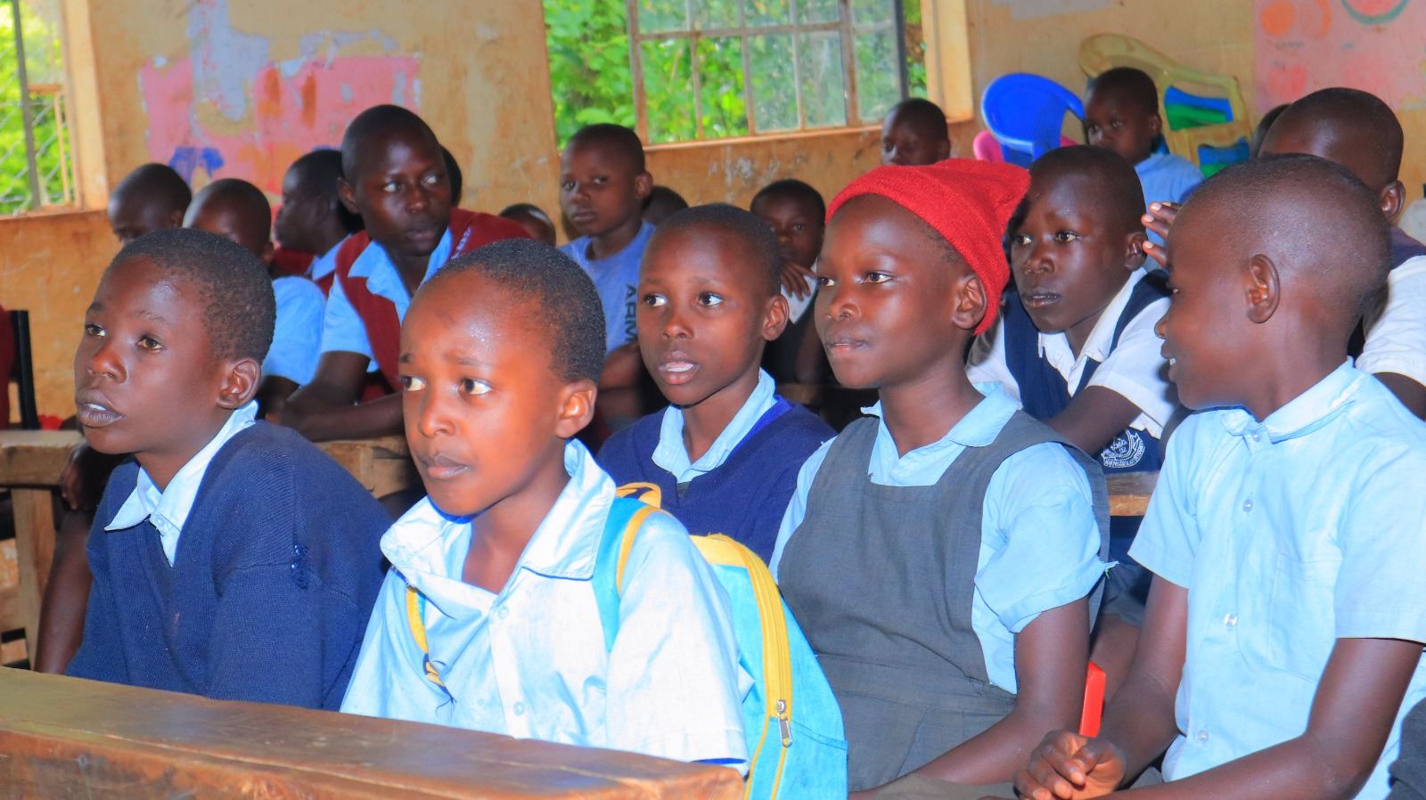 Students receiving items from youth empowerment program